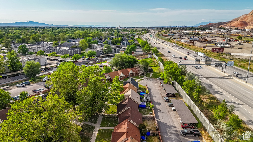 Drone / aerial view of a mountain backdrop and a major roadway