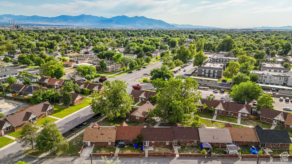Aerial view of residential area featuring a mountain backdrop