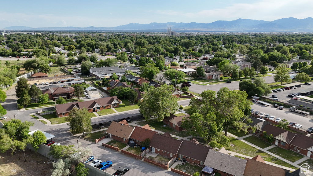 Aerial perspective of suburban area featuring a mountain backdrop