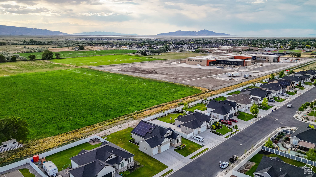Aerial perspective of suburban area with a mountain backdrop