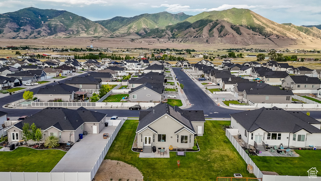 Aerial perspective of suburban area with a mountain backdrop