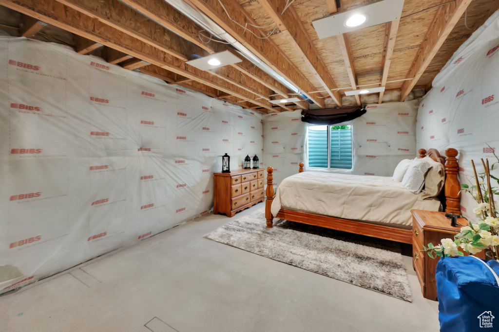 Bedroom with concrete flooring