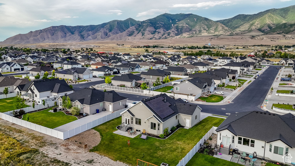 Aerial perspective of suburban area featuring a mountainous background