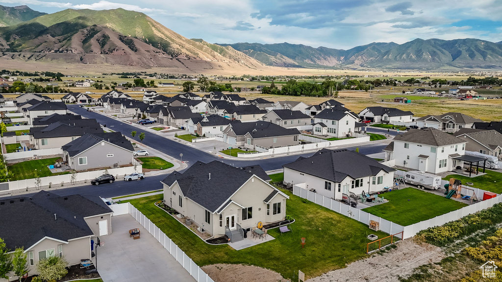 Aerial perspective of suburban area featuring a mountainous background