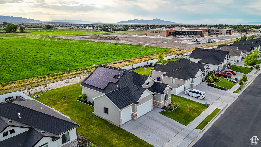 Aerial perspective of suburban area featuring a mountainous background