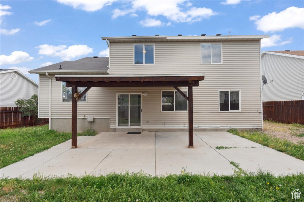 Back of property featuring a patio