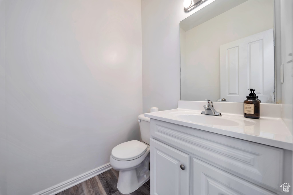 Bathroom featuring vanity and wood finished floors