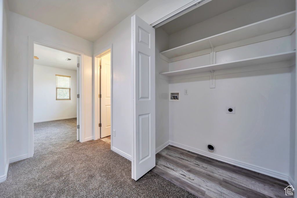 Laundry area featuring hookup for an electric dryer, hookup for a washing machine, and carpet flooring