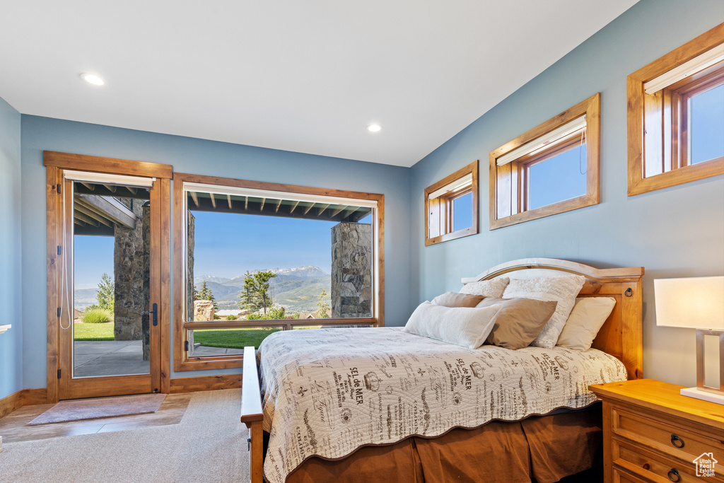 Carpeted bedroom featuring access to outside, multiple windows, a mountain view, and recessed lighting