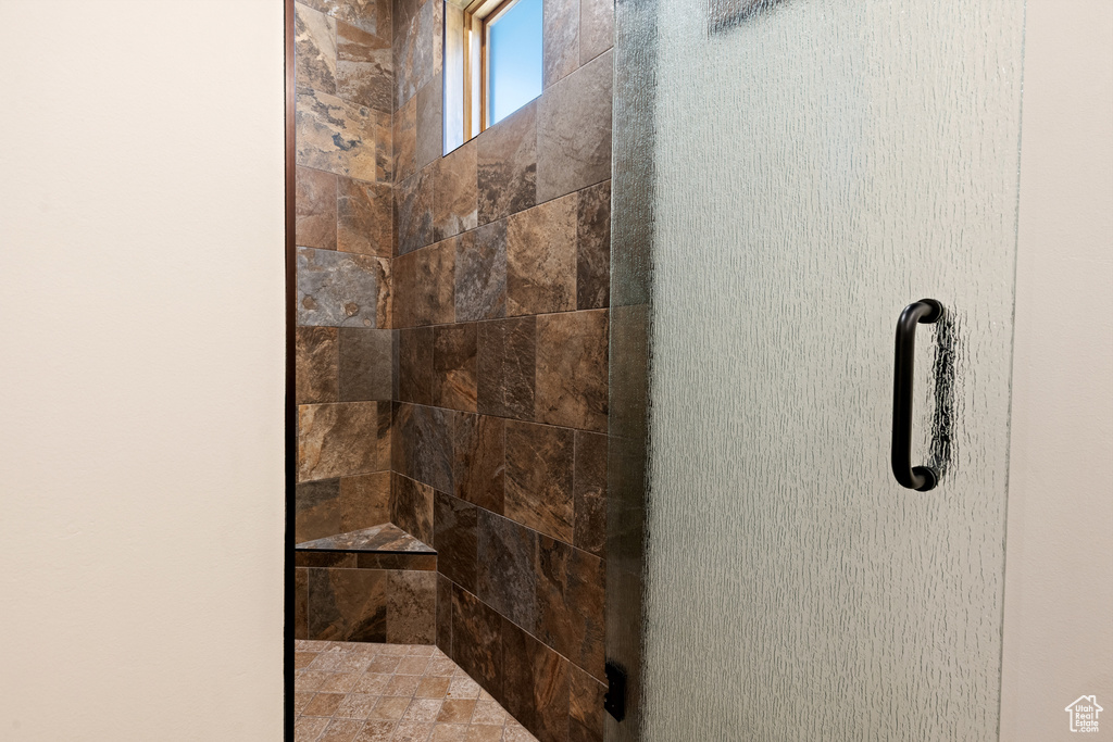 Full bath with a tile shower