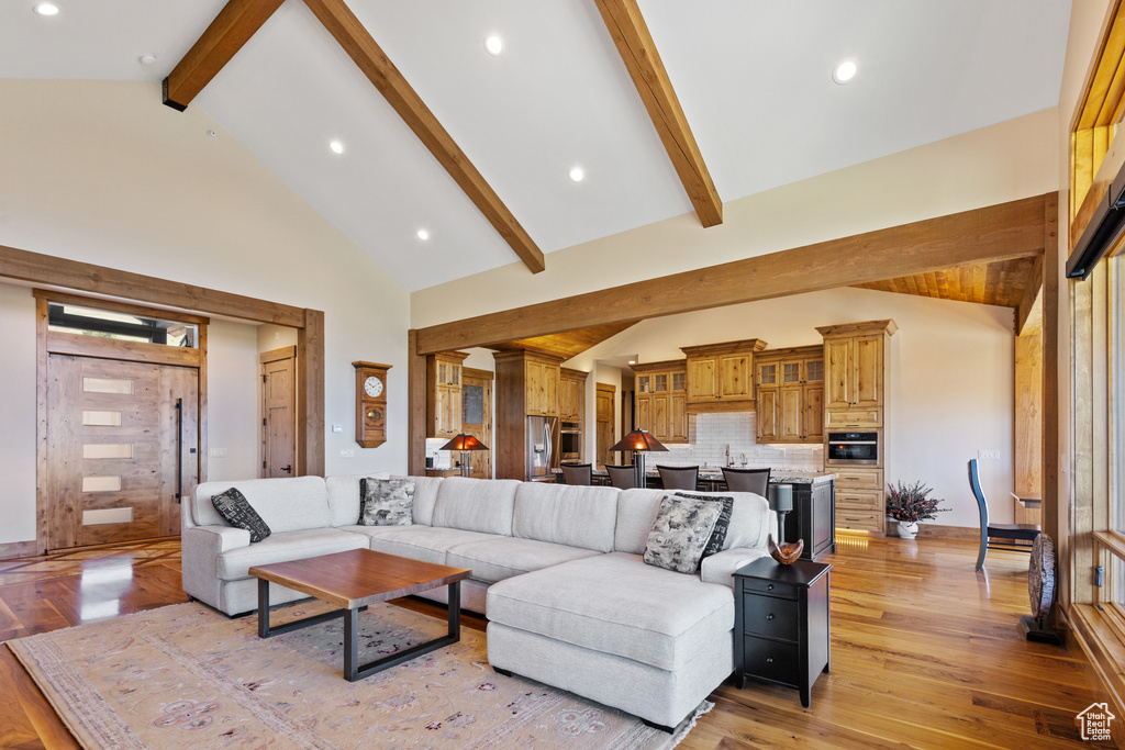 Living area featuring light wood-style flooring and recessed lighting