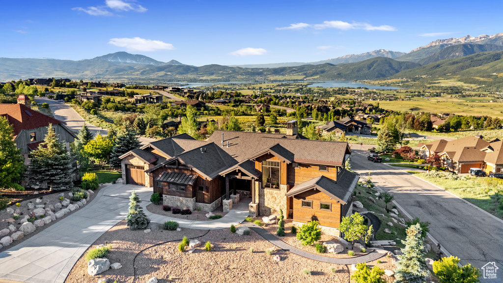 Aerial perspective of suburban area with a mountainous background