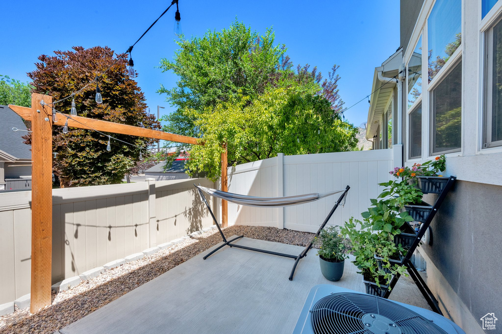Fenced backyard with a patio