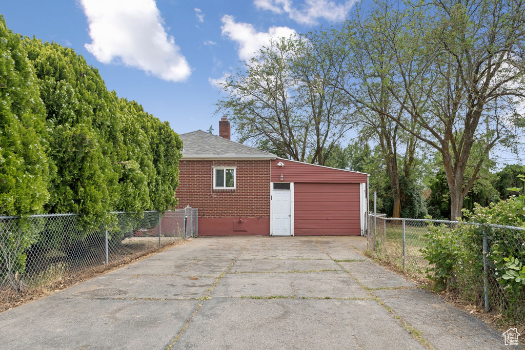 Garage featuring concrete driveway