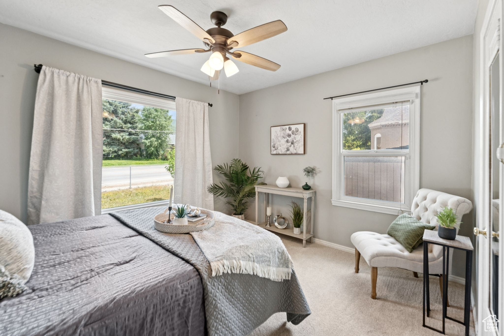 Bedroom with carpet flooring and ceiling fan