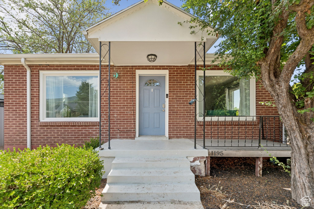 View of front of house with brick siding