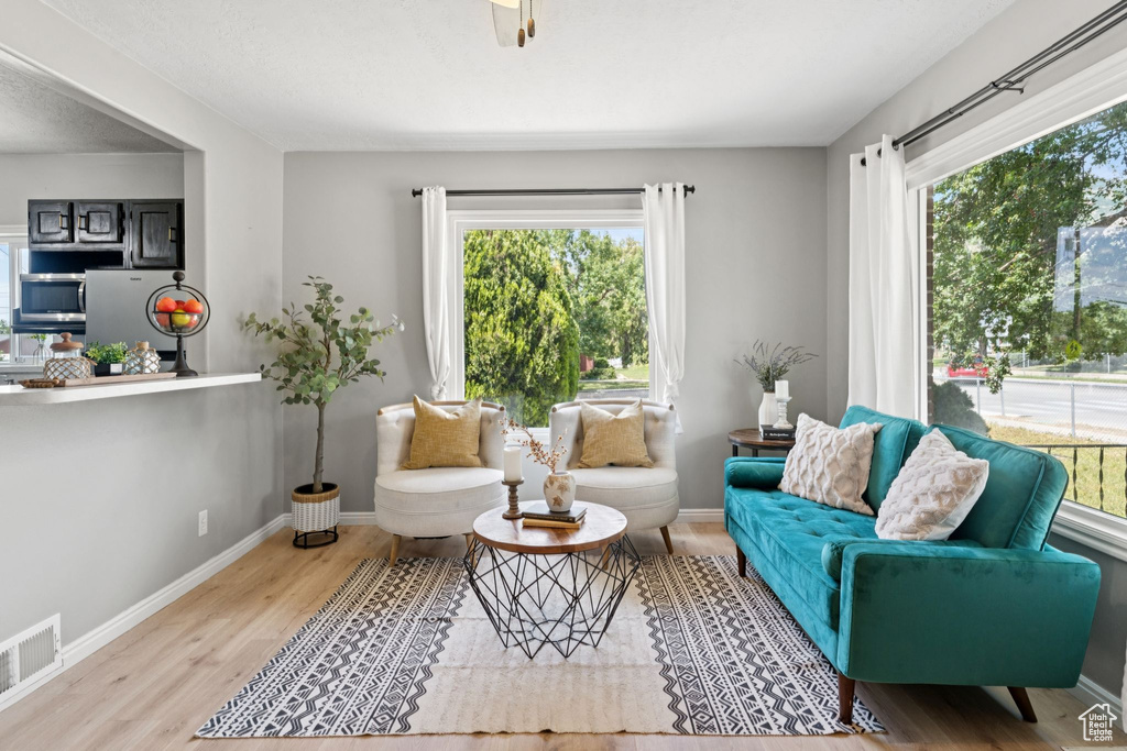 Living room with wood finished floors and baseboards