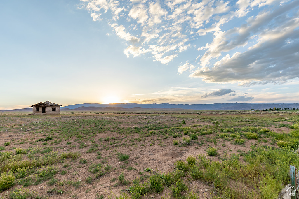 View of mountain backdrop with rural landscape