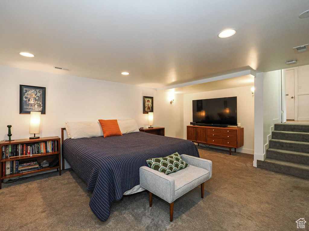 Carpeted bedroom with recessed lighting