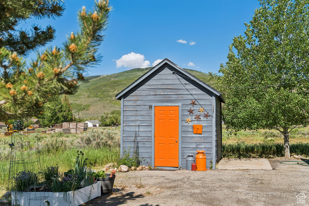 View of shed with a mountain view