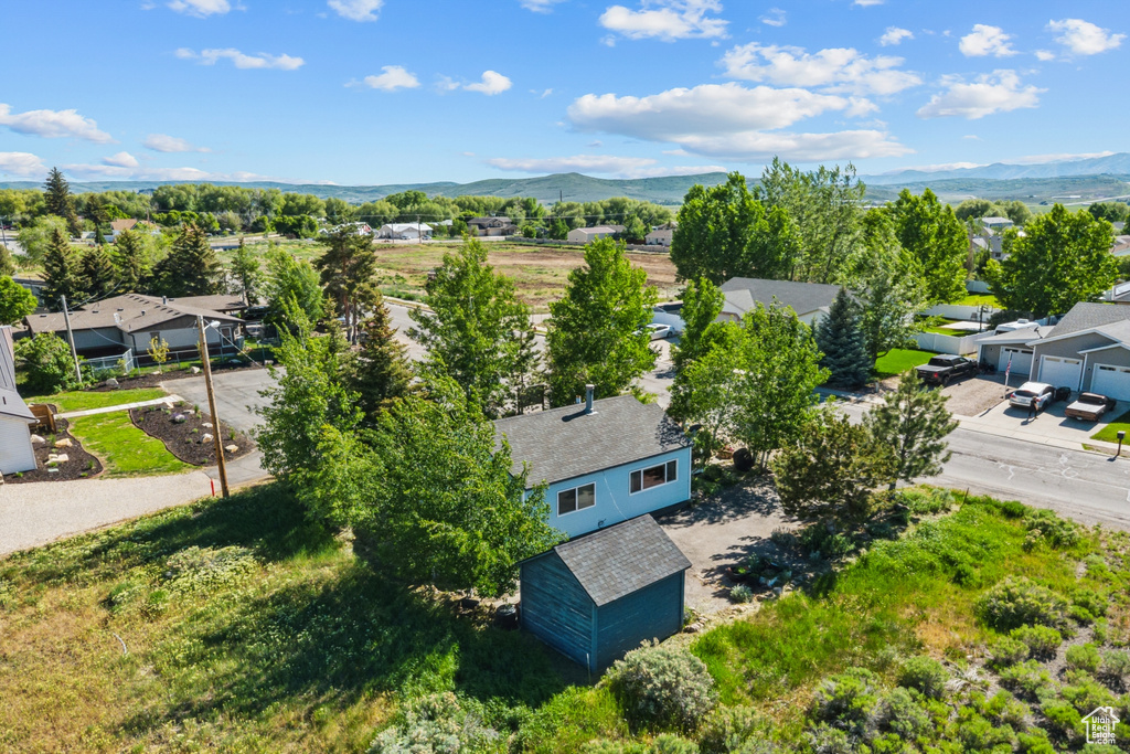Aerial view of residential area featuring a mountain backdrop