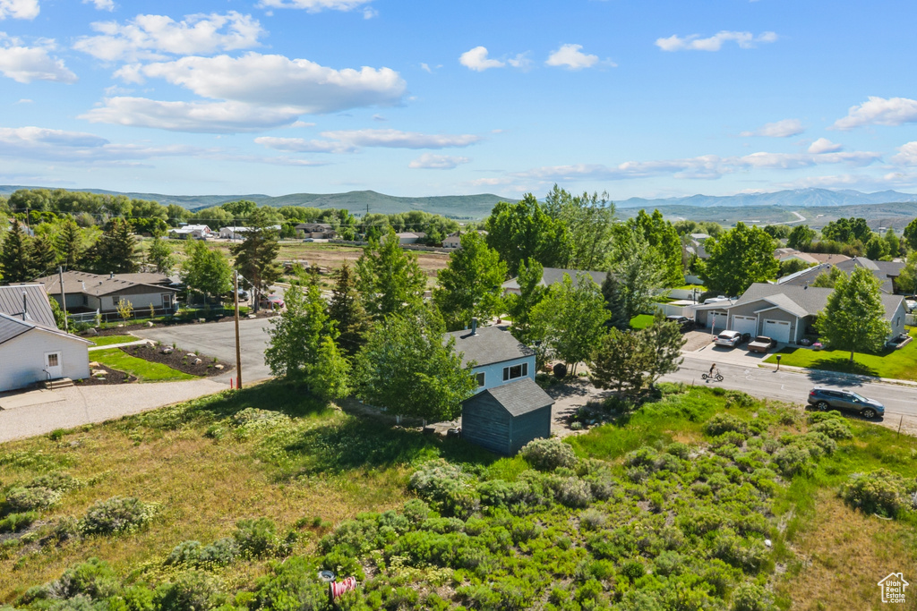 Aerial perspective of suburban area featuring a mountain backdrop