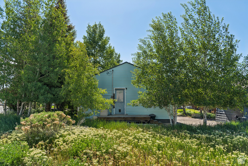 Back of property with a wooden deck