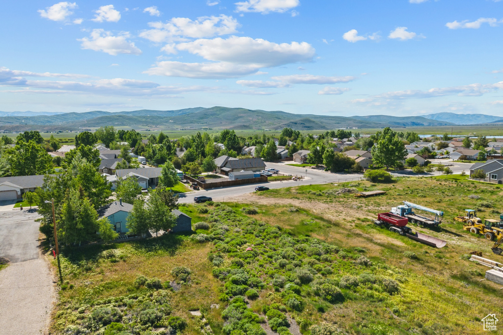 Aerial perspective of suburban area with a mountain backdrop