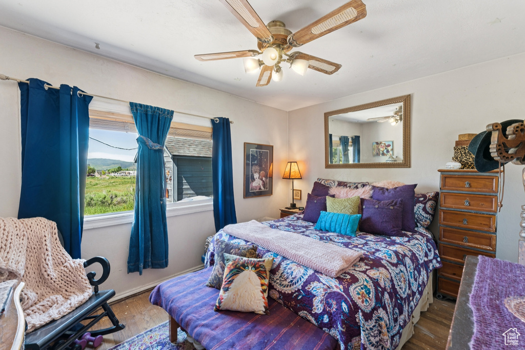 Bedroom featuring wood finished floors and ceiling fan