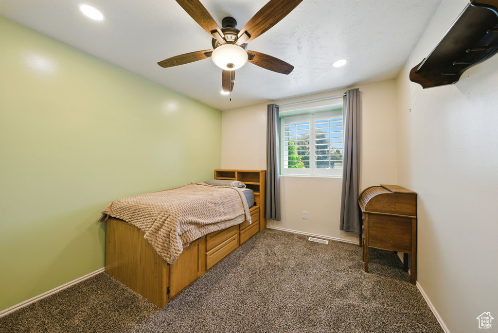 Bedroom featuring dark colored carpet, recessed lighting, and ceiling fan