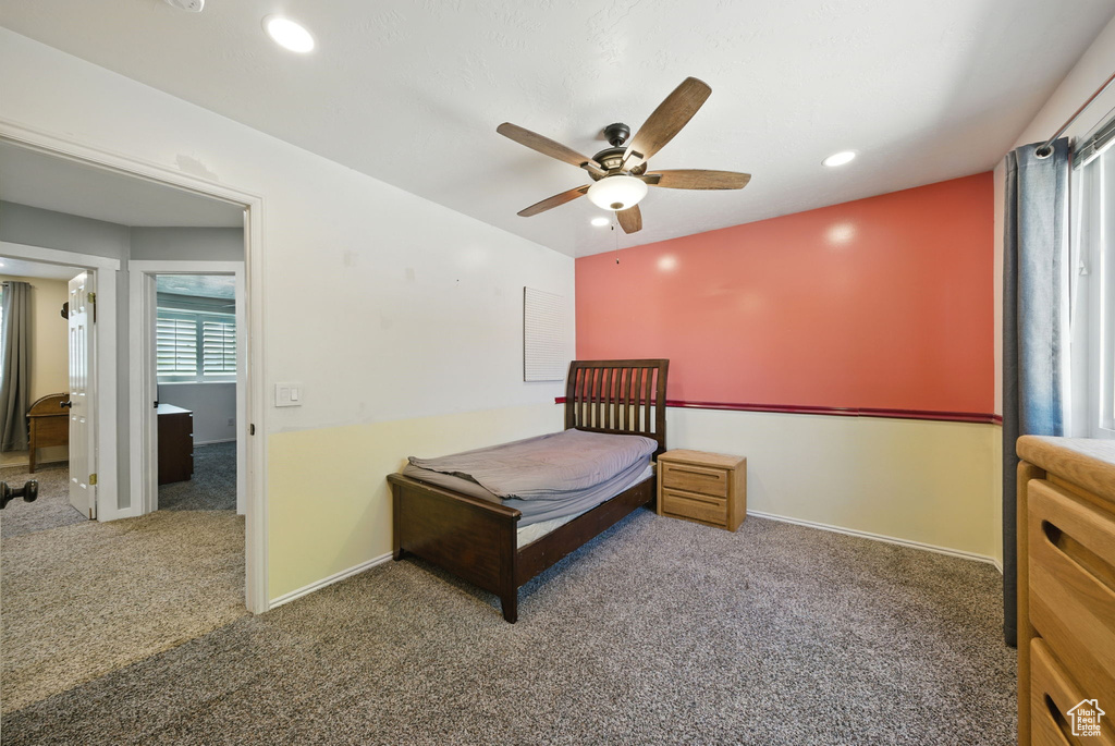 Carpeted bedroom featuring recessed lighting and ceiling fan