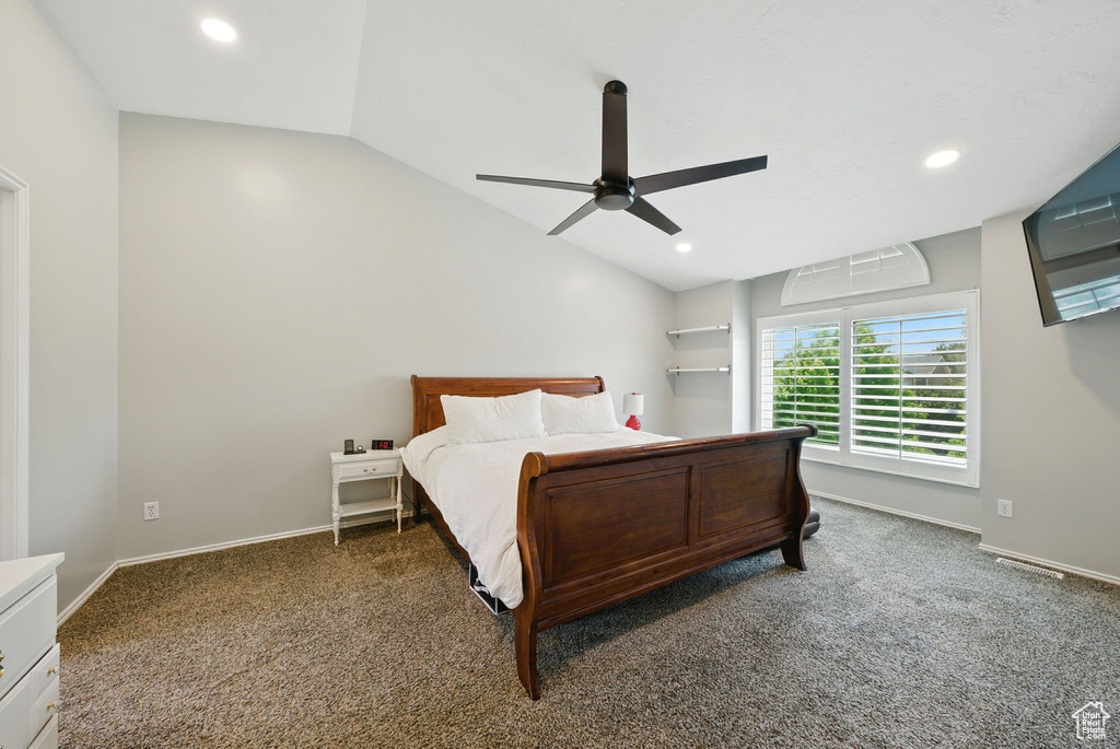 Carpeted bedroom with vaulted ceiling, recessed lighting, and ceiling fan
