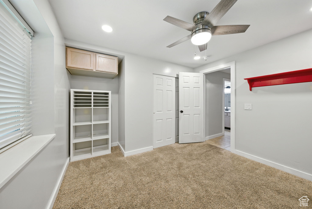 Unfurnished bedroom featuring carpet flooring, recessed lighting, and a ceiling fan