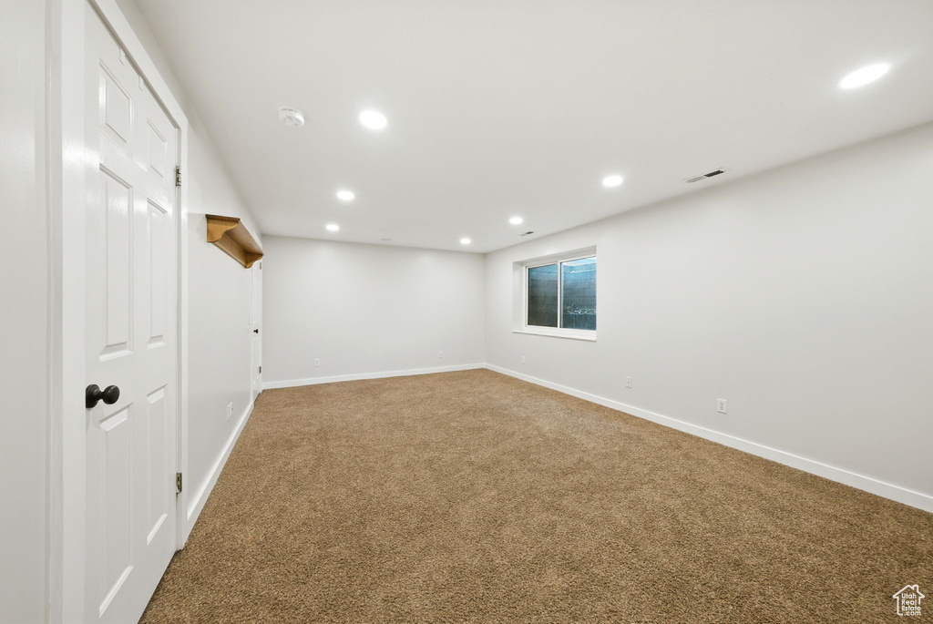 Basement featuring carpet and recessed lighting