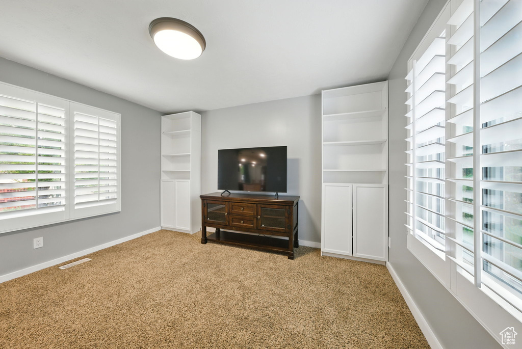 Unfurnished bedroom featuring carpet