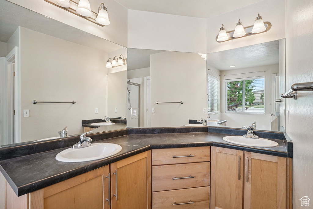 Bathroom featuring double vanity