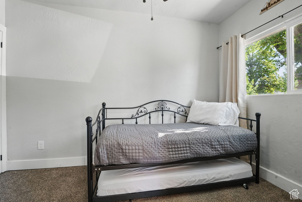 Bedroom with carpet and baseboards