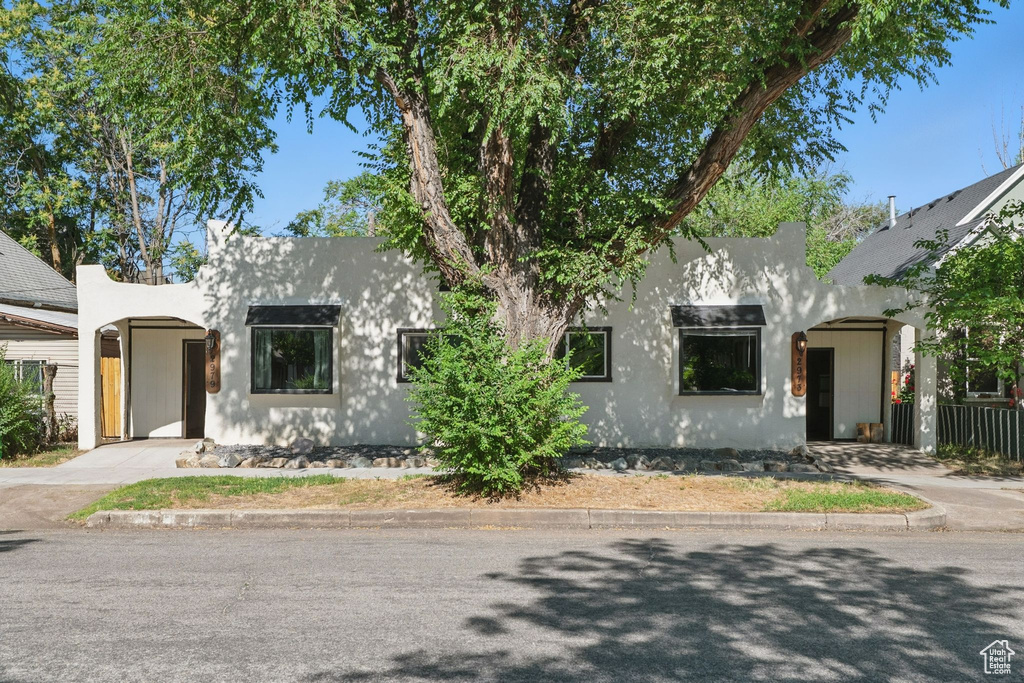 View of front of property featuring stucco siding