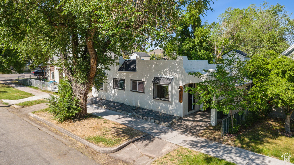View of front facade featuring stucco siding