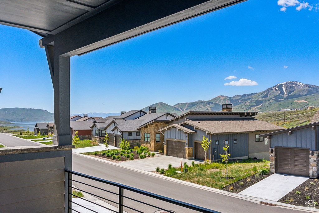 Balcony featuring a mountain view and a residential view