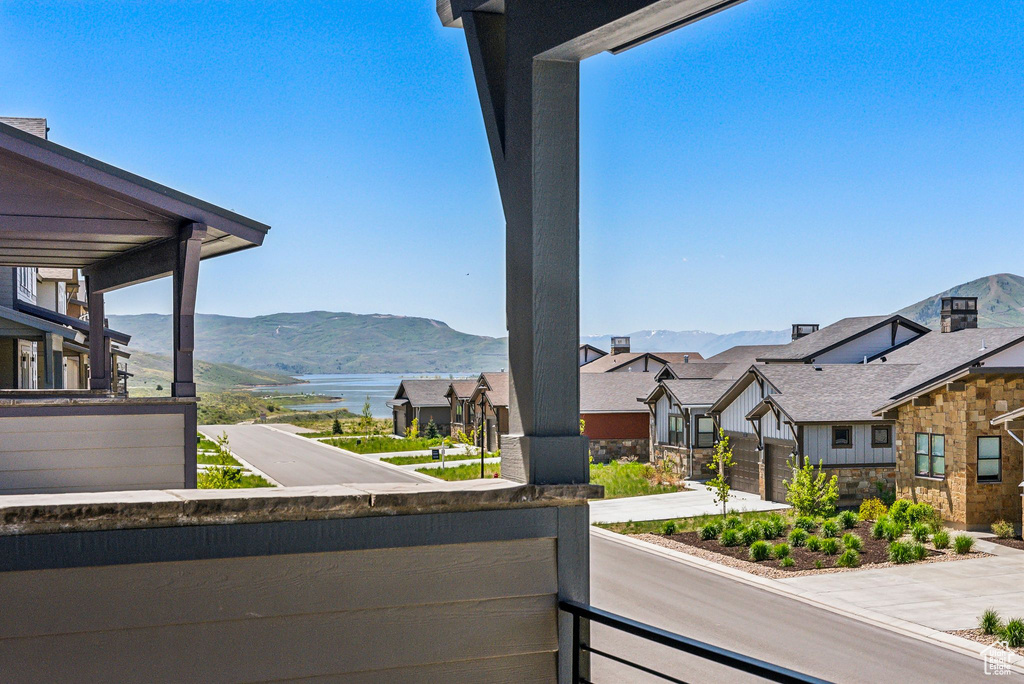 Balcony featuring a mountain view and a residential view