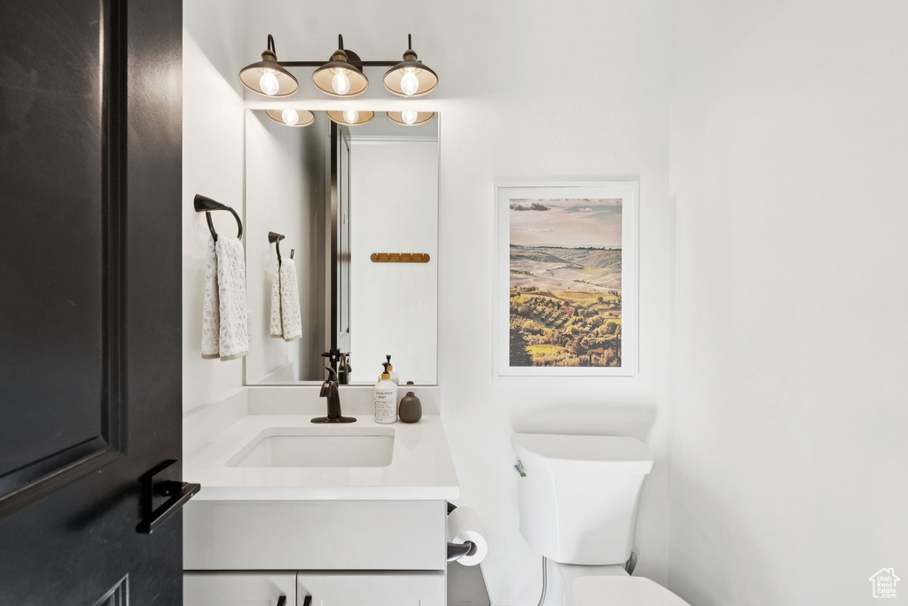 Bathroom featuring vanity and toilet