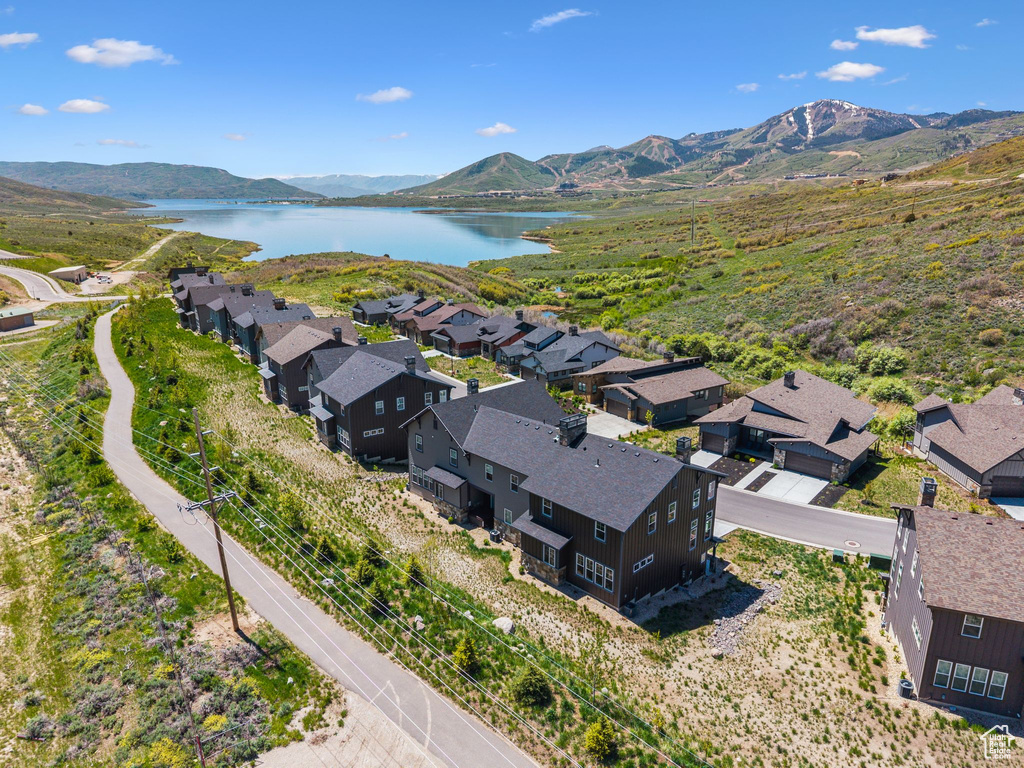 Aerial perspective of suburban area featuring a water and mountain view