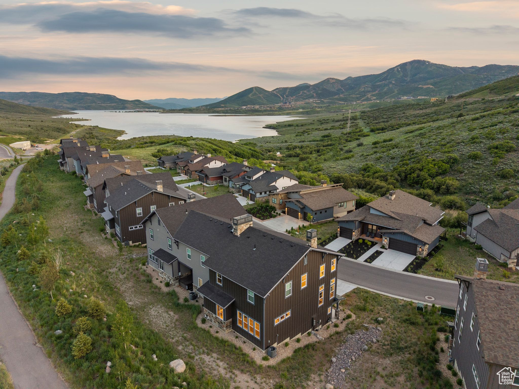 Aerial perspective of suburban area with a water and mountain view