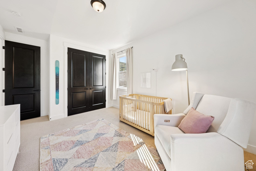 Carpeted bedroom featuring baseboards