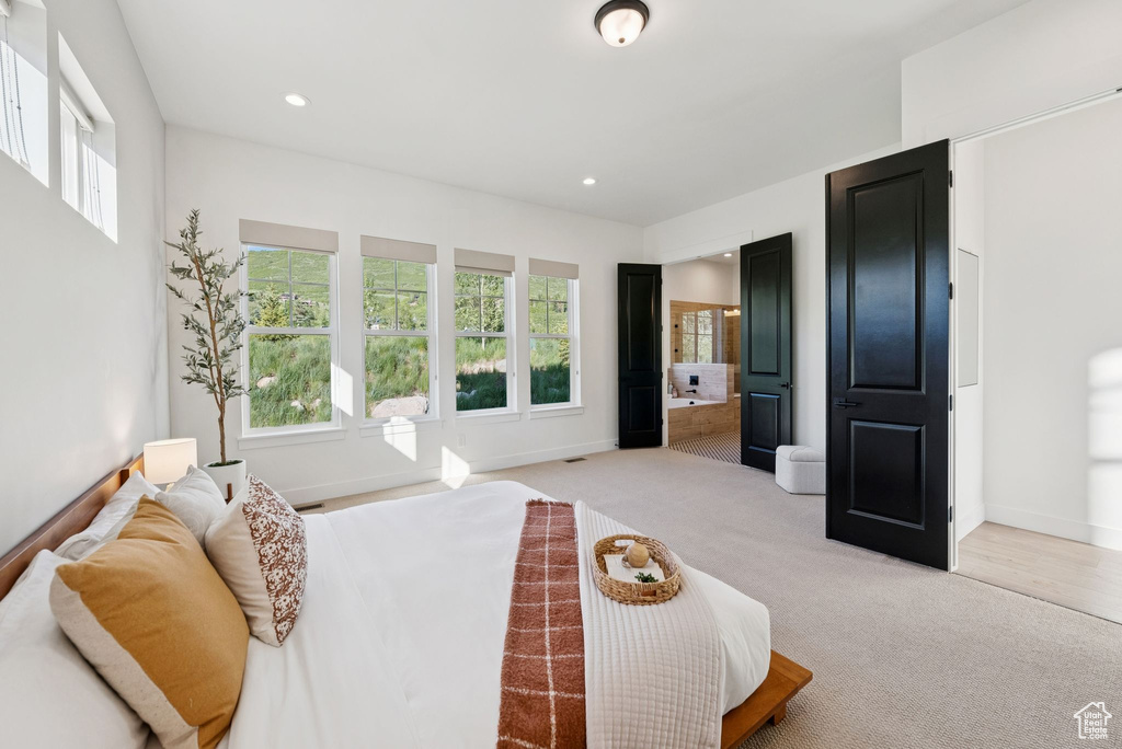Carpeted bedroom with baseboards and recessed lighting
