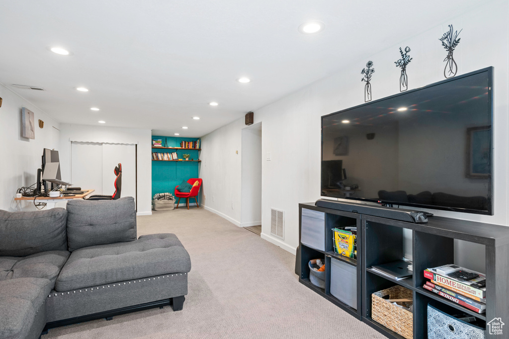 Living room featuring recessed lighting, carpet floors, and baseboards