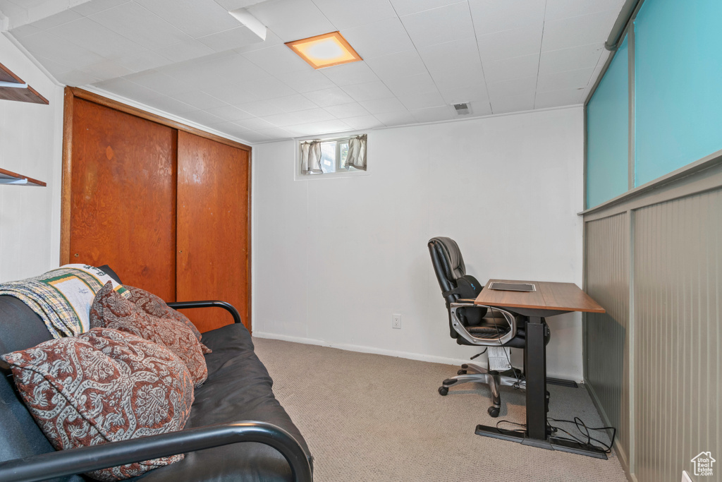 Carpeted office featuring baseboards