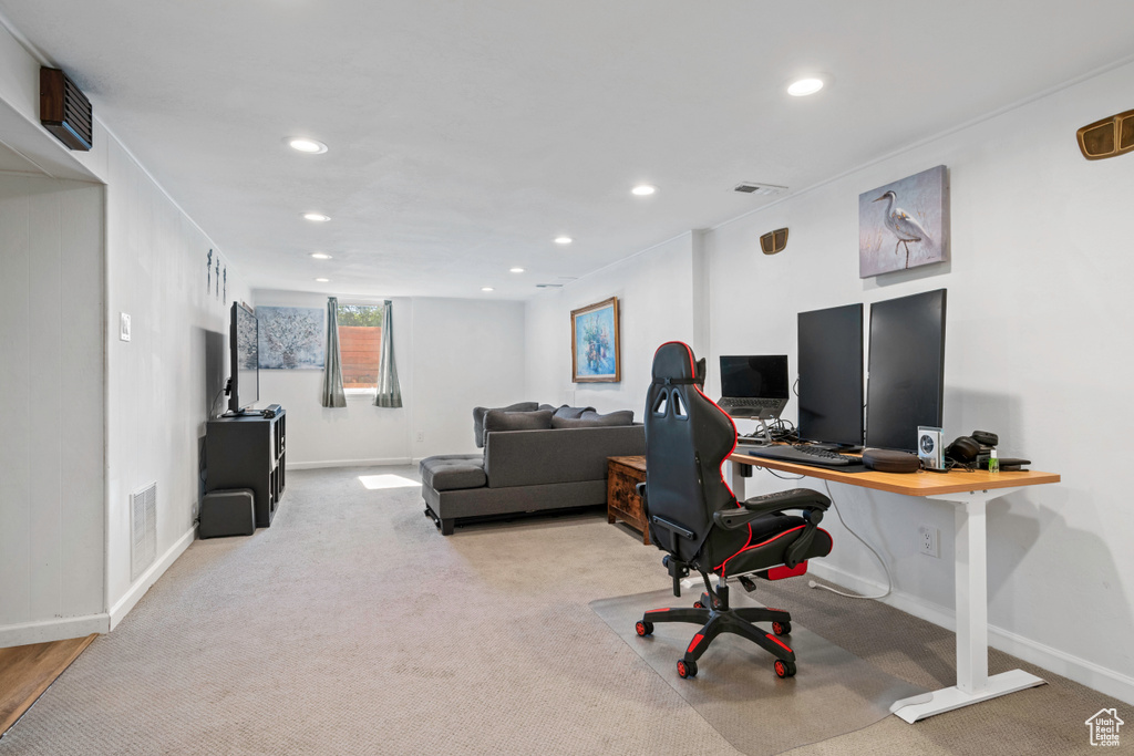 Carpeted office with recessed lighting and baseboards