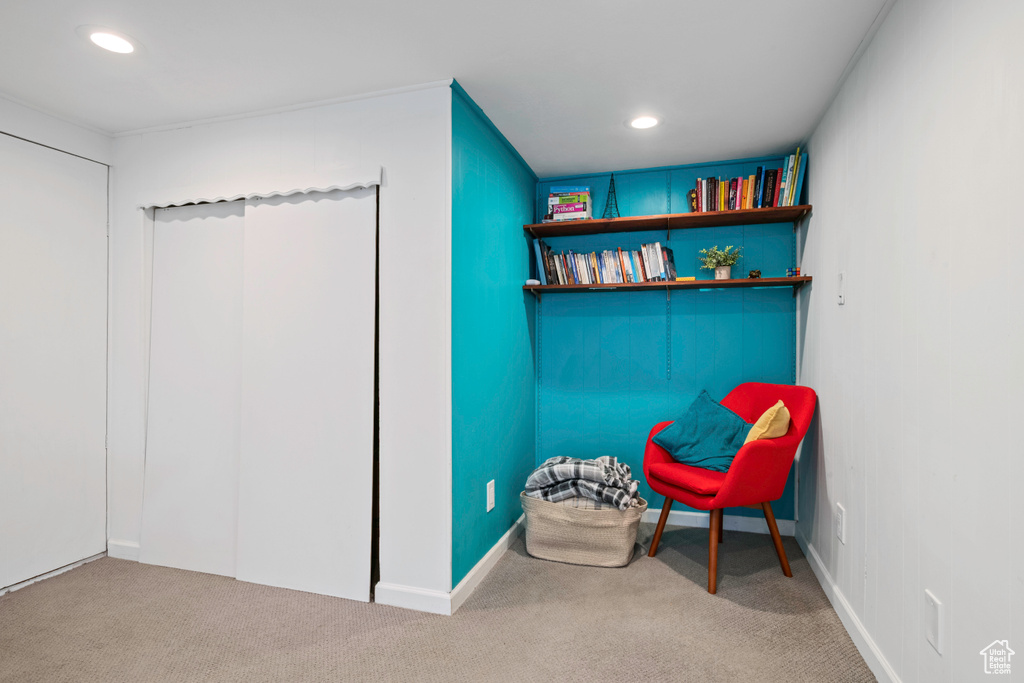 Living area featuring carpet and recessed lighting